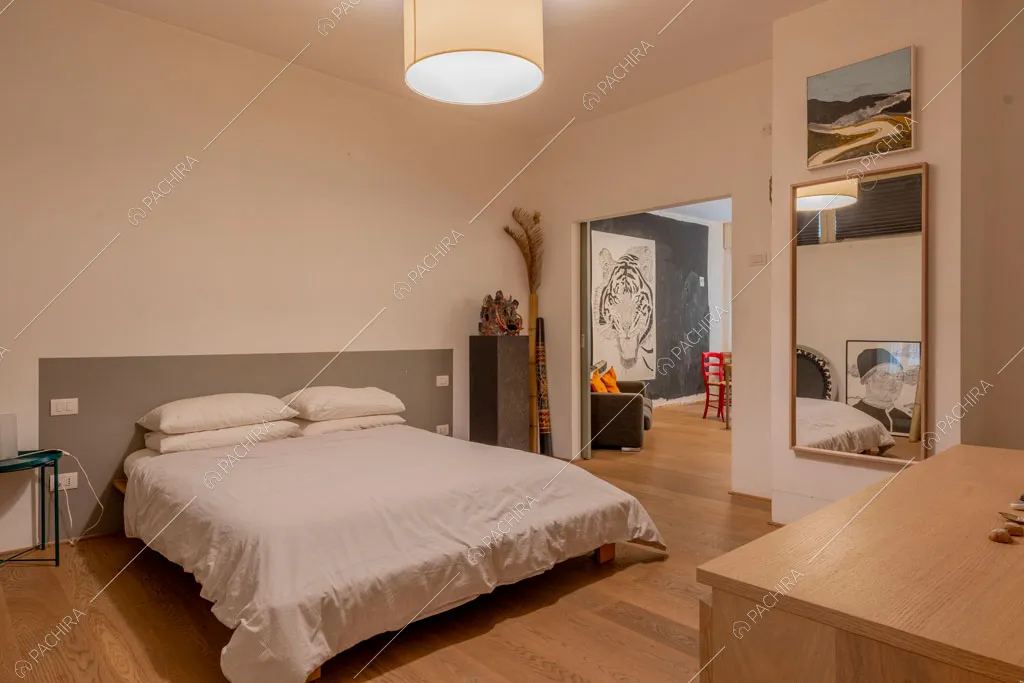 Camera da letto dell'appartamento Mungo, location in stile contemporaneo a Milano