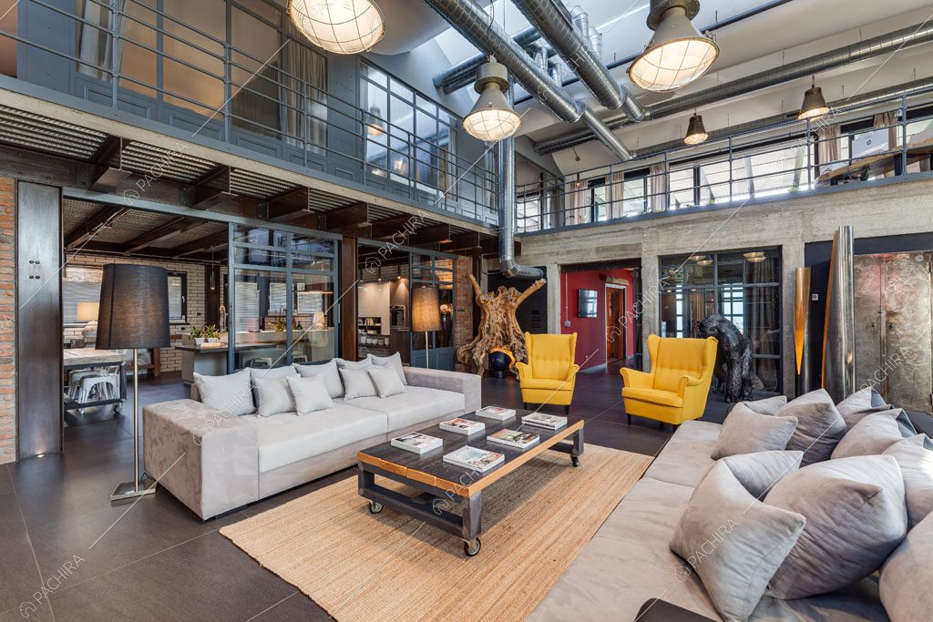 Zona living del loft Argan, location in stile industriale a Roma
