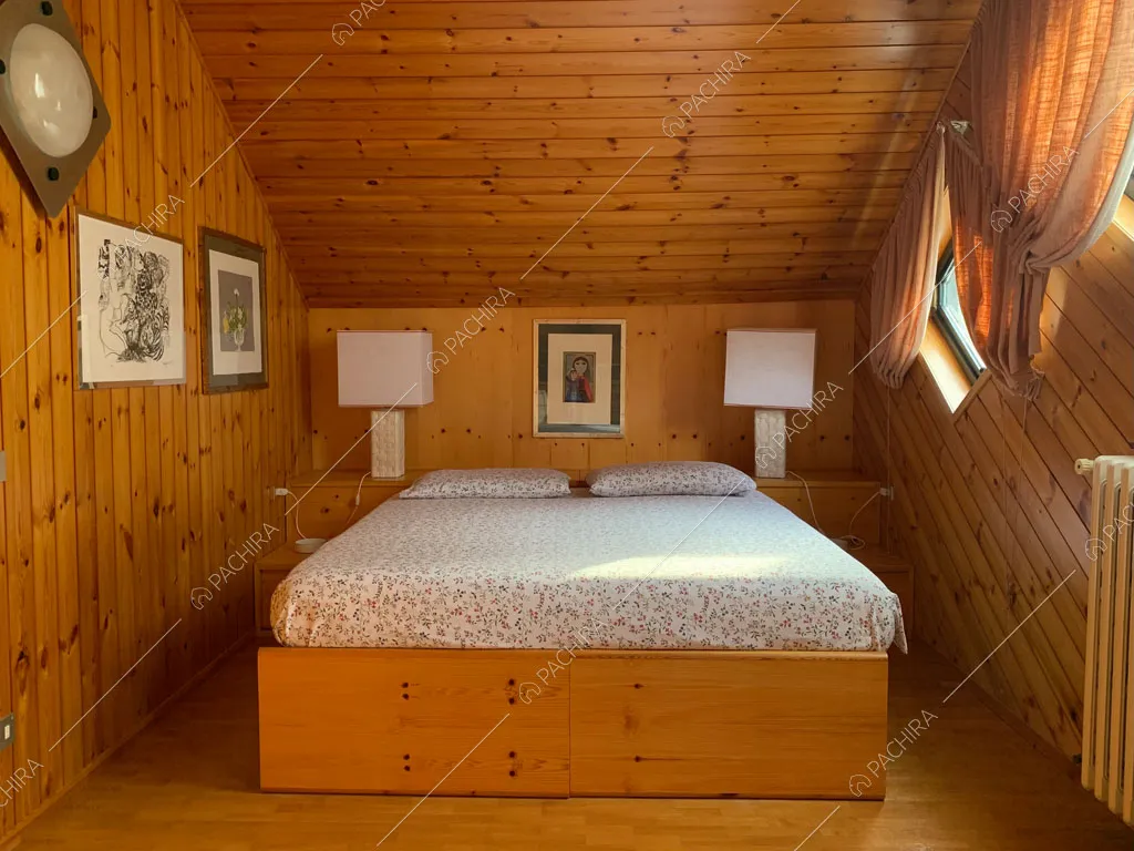 Camera da letto dello chalet Bulbine, location in stile moderno a Belluno