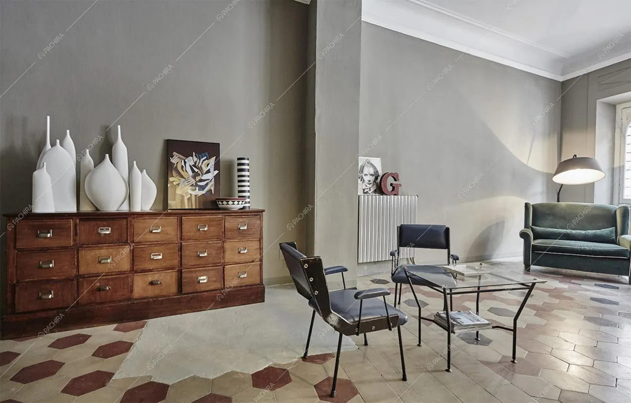 Zona living con cassettiera in legno e mobili di design