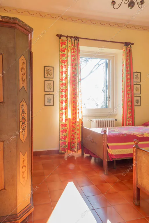 Camera da letto della dimora storica Logan, location in stile classico a Roma