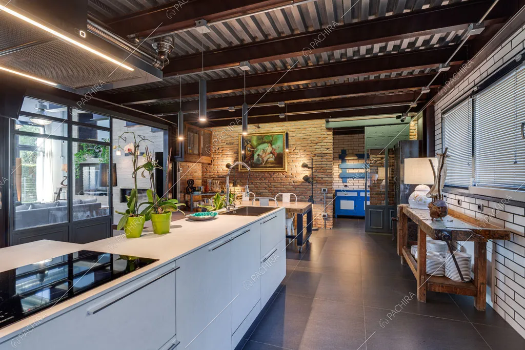 Cucina a isola del loft Argan, location in stile industriale a Roma