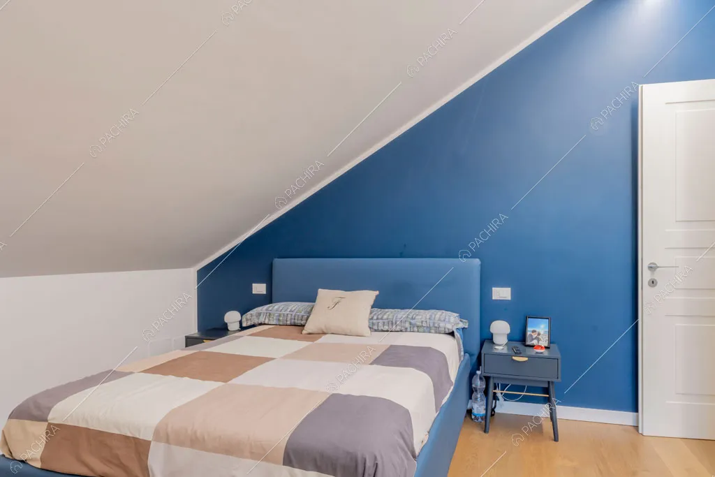 Camera da letto della villa Orinoco, location in stile contemporaneo a Roma