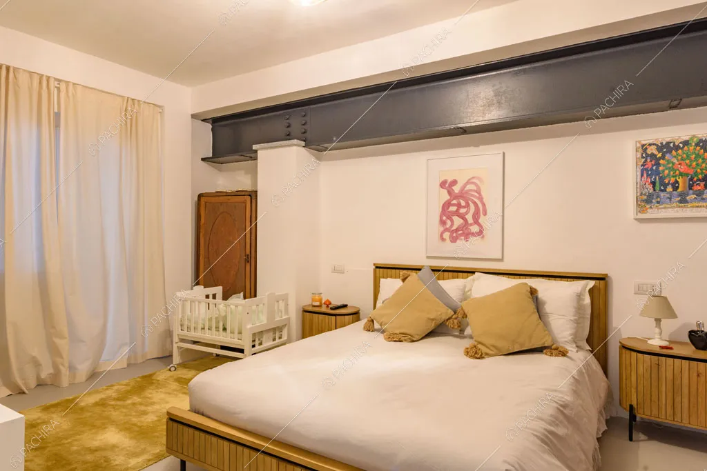 Camera da letto matrimoniale del loft Genepi, location in stile contemporaneo a Milano
