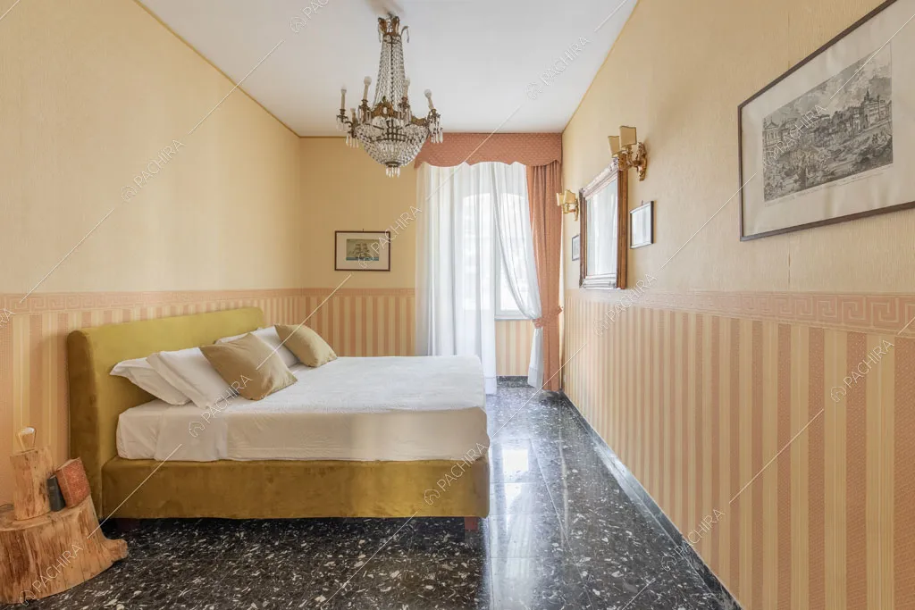 Camera da letto matrimoniale dell'appartamento Crescione, location in stile contemporaneo a Roma