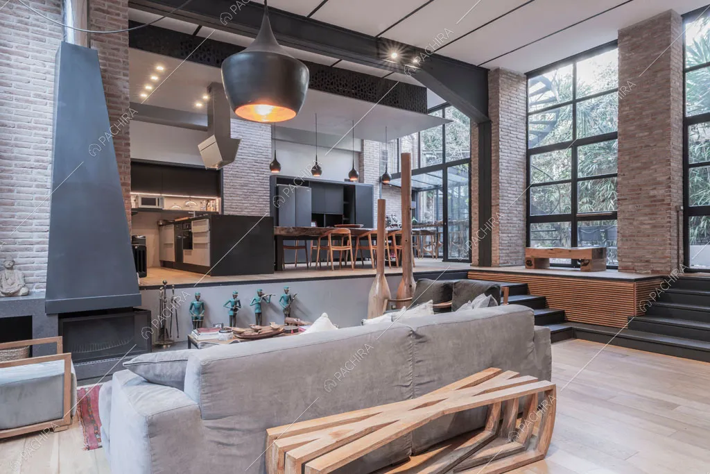 Salotto con camino del loft Berillio, location in stile contemporaneo a Roma