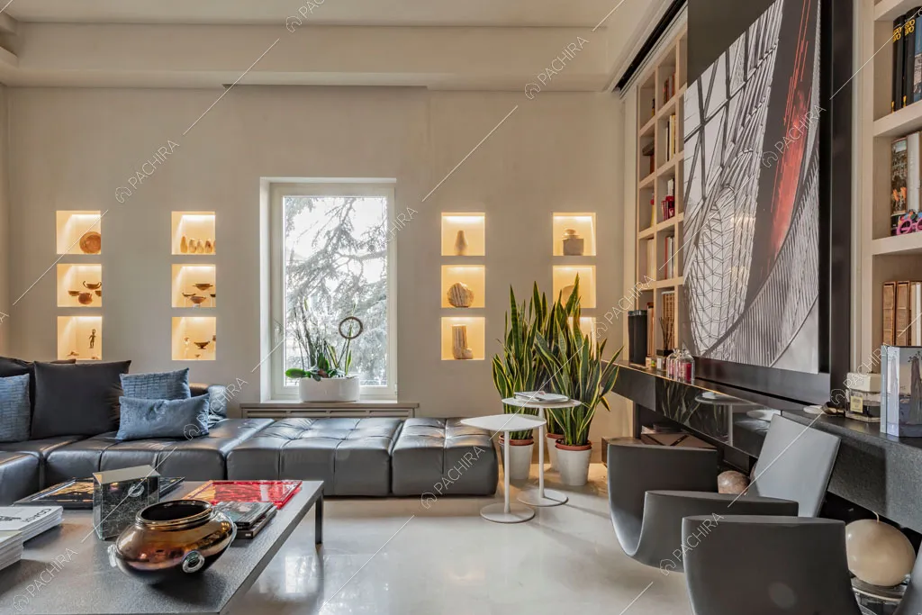 Libreria nella zona living dell'appartamento Kamala, location in stile contemporaneo a Roma