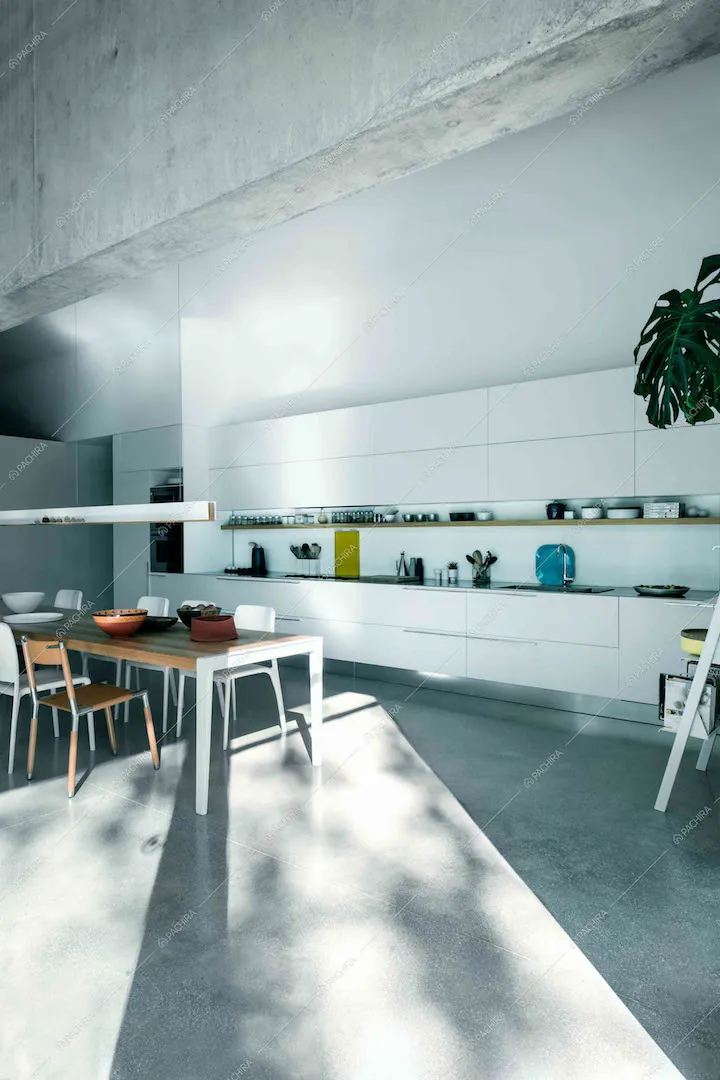 Zona cucina con lungo tavolo da pranzo