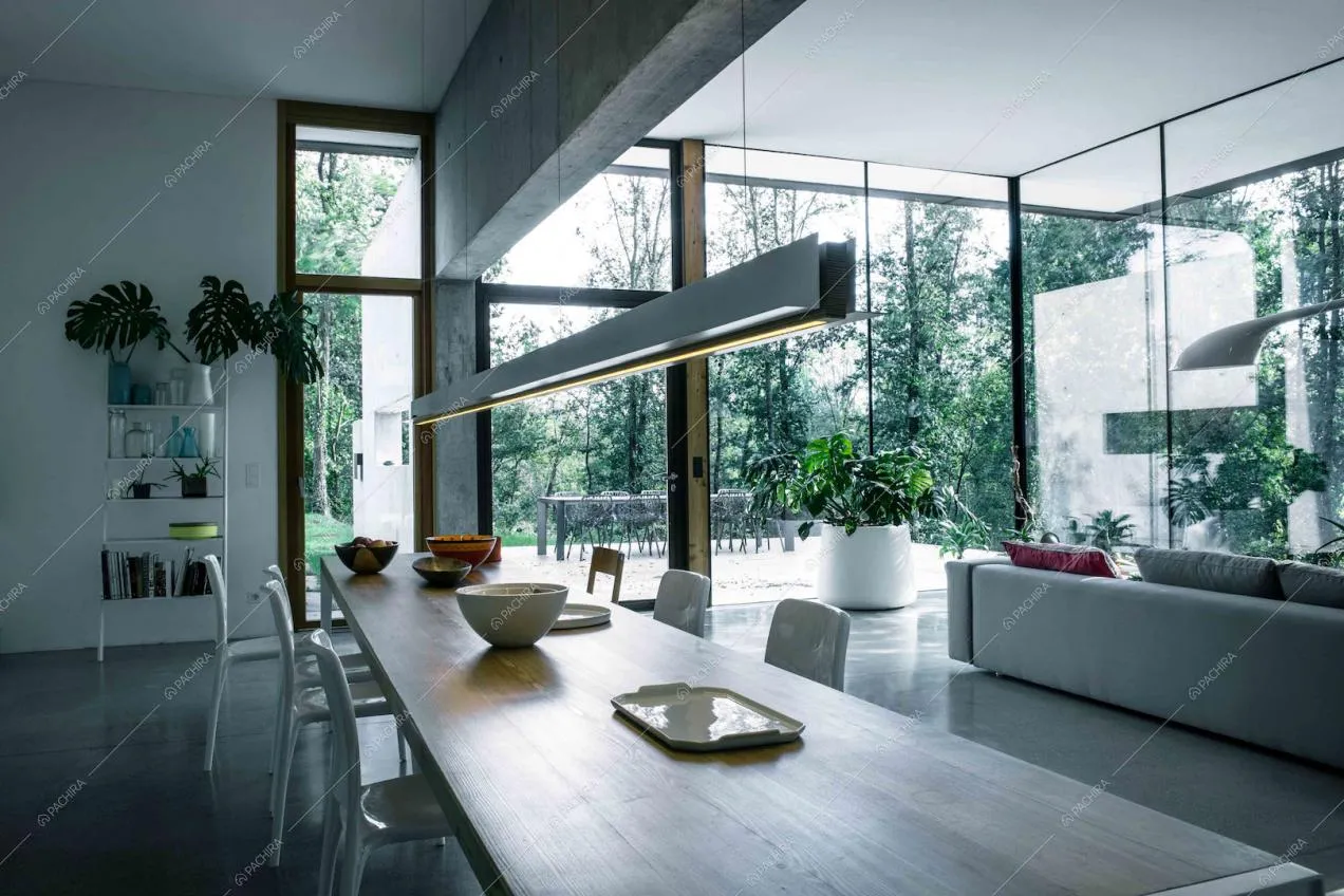 Zona living con pavimento in cemento lisciato