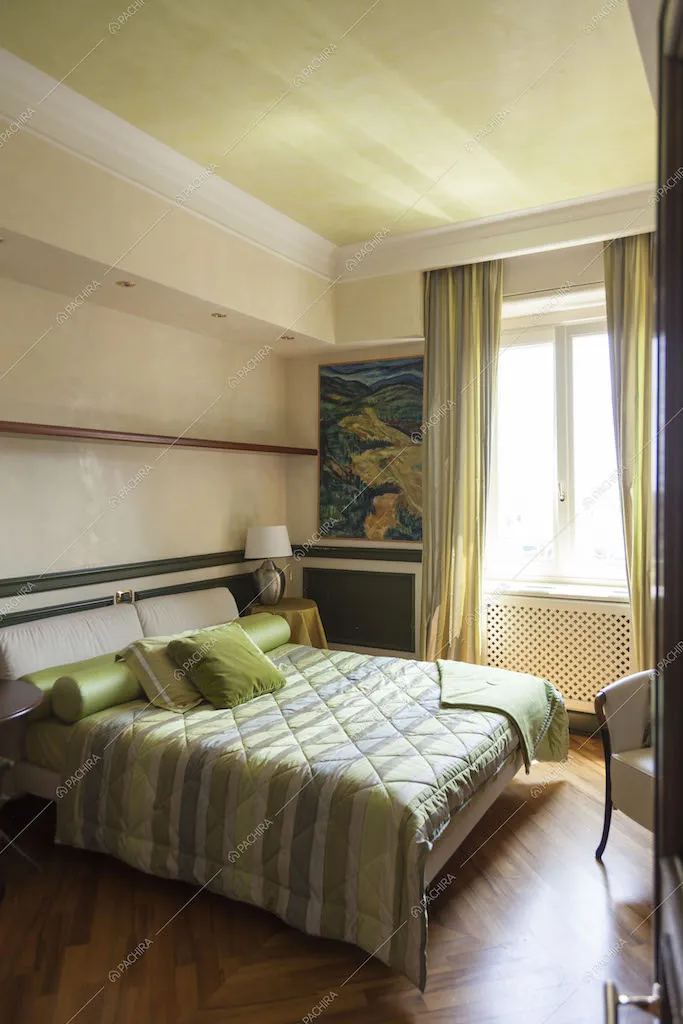 Camera da letto con sfumature verdi
