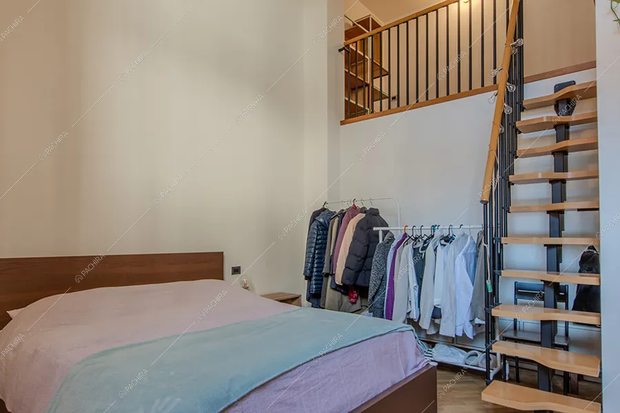 Camera da letto dell'appartamento Tonga, location in stile moderno a Milano