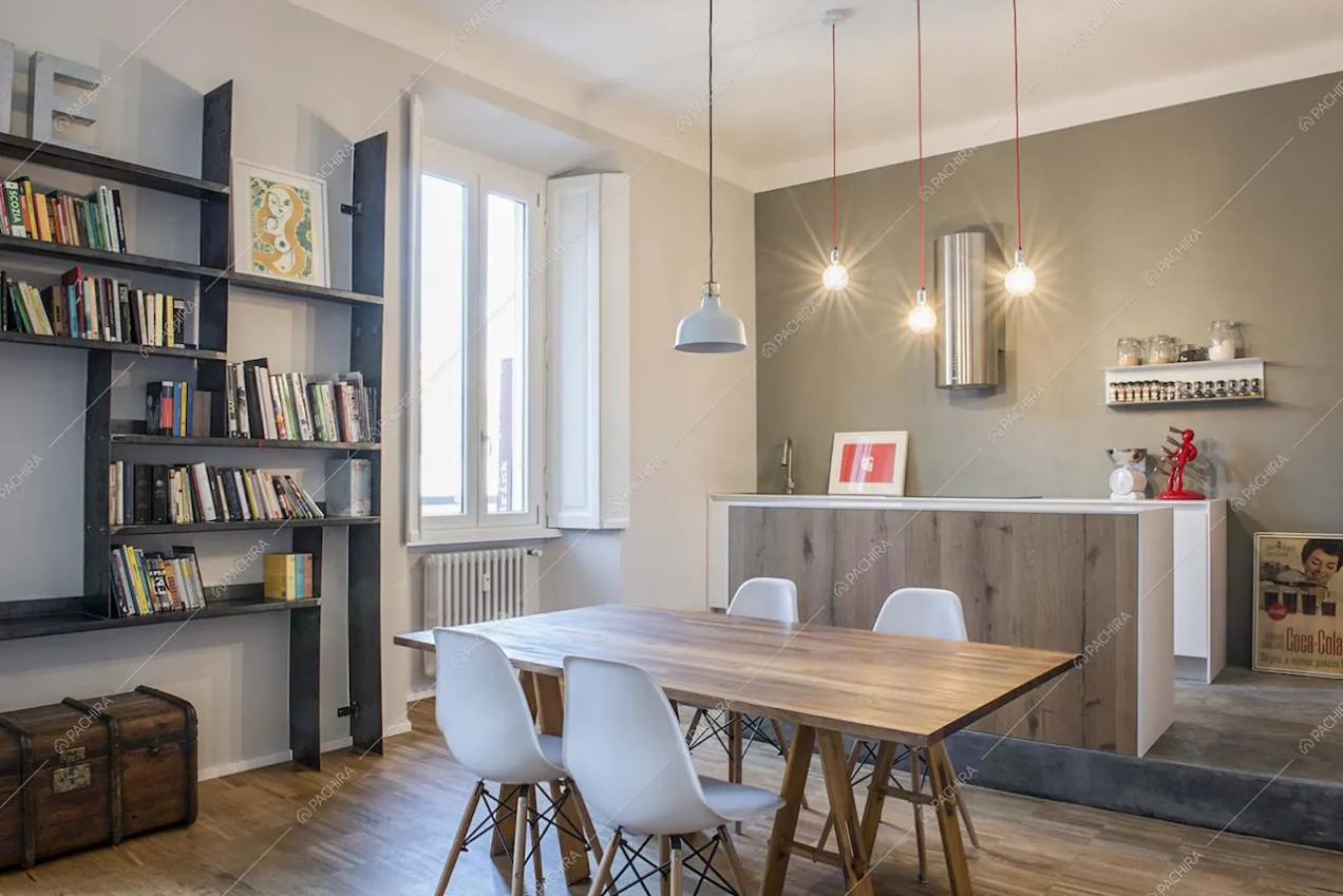 Sala da pranzo con cucina a vista in stile contemporaneo