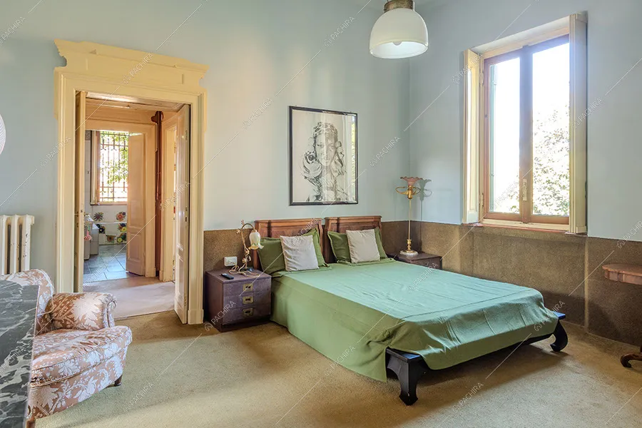 Camera da letto della villa Nitra, location in stile vintage a Milano