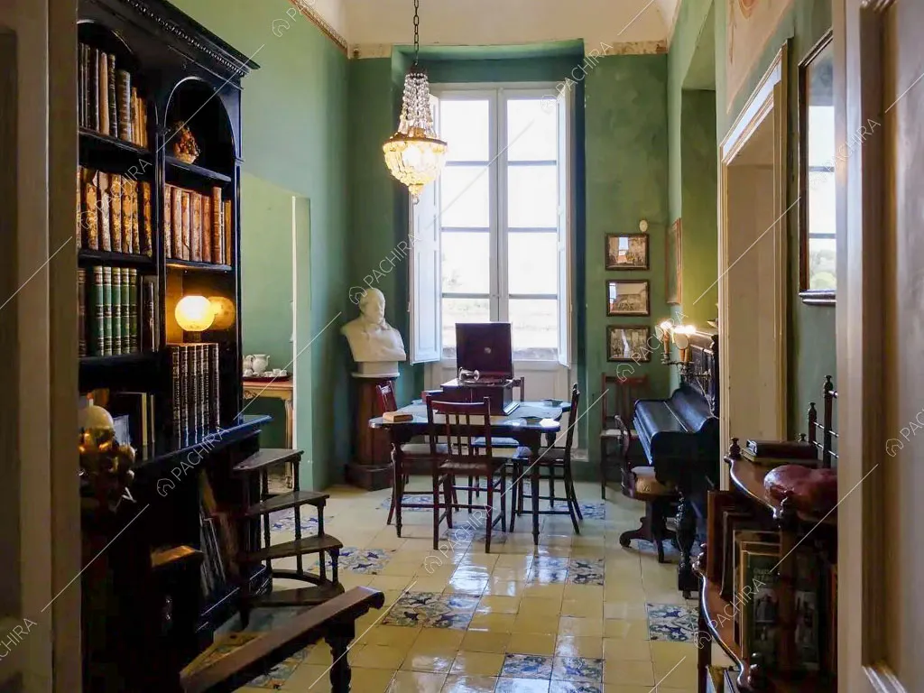 Biblioteca con pareti verdi e pianoforte della villa Tanami, location in stile classico a Palermo