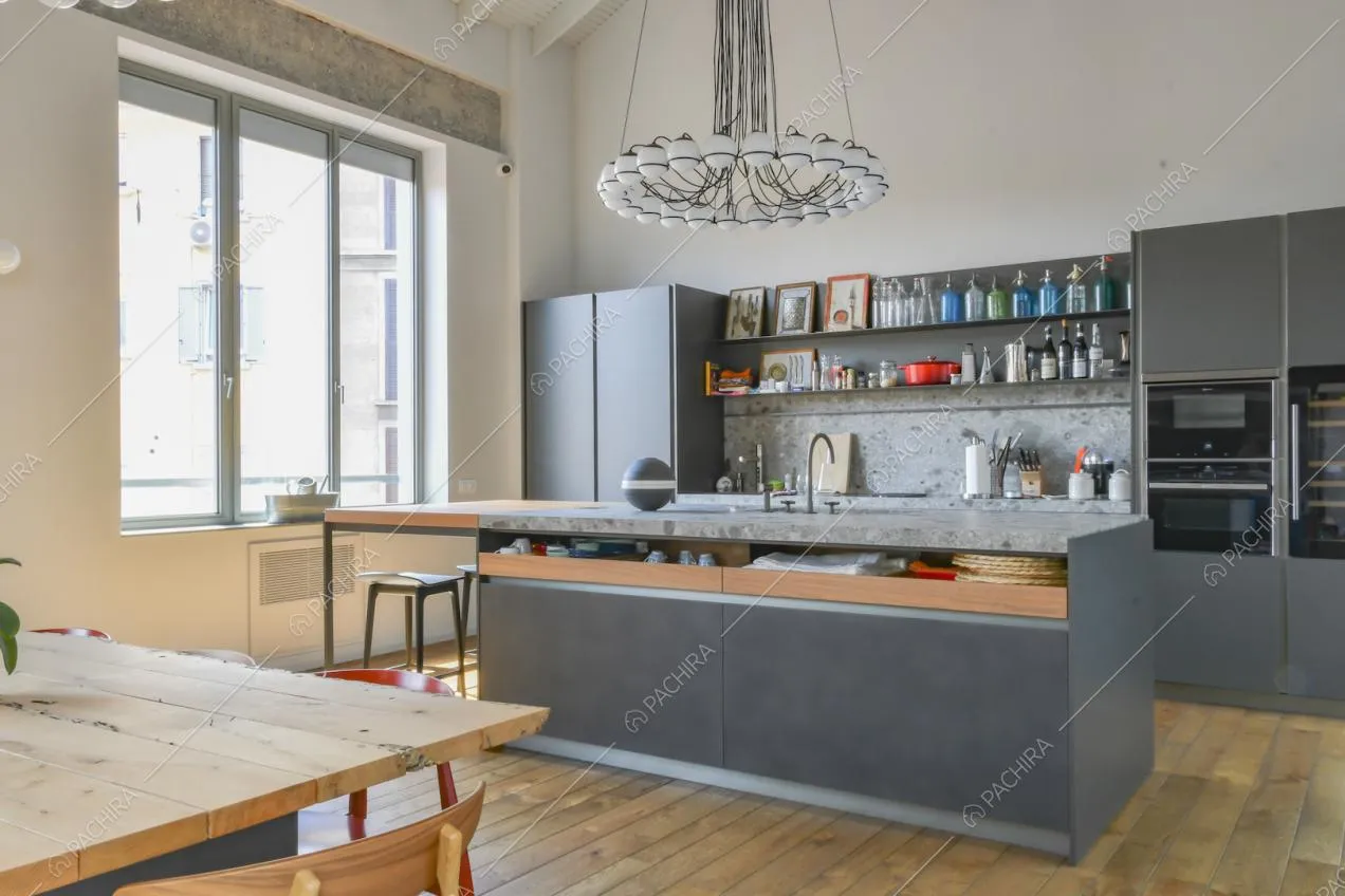 Mobili color grigio per la cucina a isola con elettrodomestici integrati