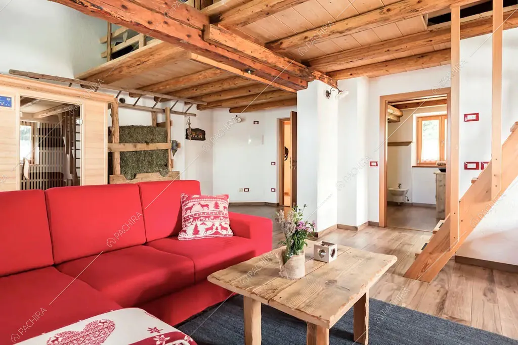 Zona living dello chalet Cantabrico, location in stile rustico a Trento