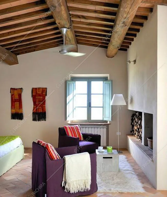 Camera da letto con camino della villa Monegros, location in stile contemporaneo a Viterbo