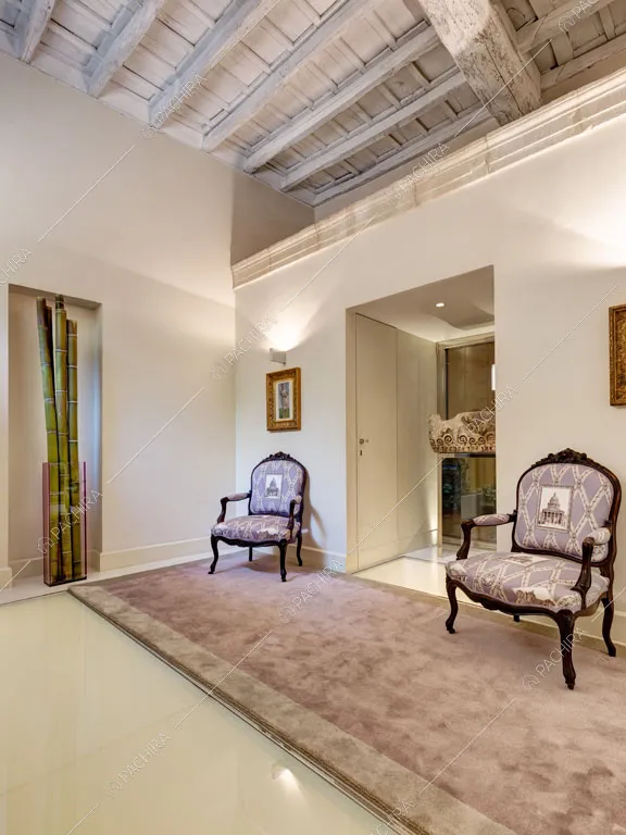 Pavimento in resina nella zona living dell'appartamento Passiflora, location in stile contemporaneo a Roma