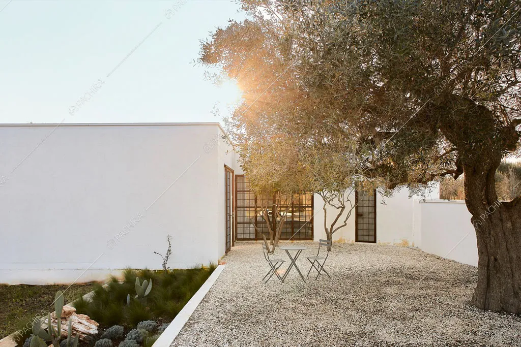 Pavimento in ciottolato nel giardino della masseria Ryn, location in stile contemporaneo a Brindisi