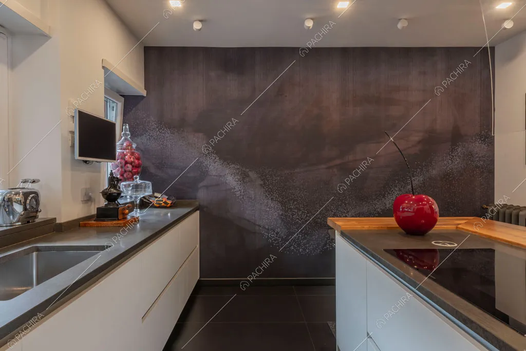 Isola con fornelli a induzione nella cucina dell'appartamento Jojoba, location in stile contemporaneo a Roma