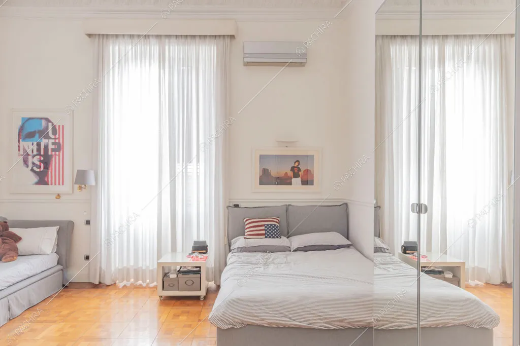 Camera da letto dell'appartamento Kiwano, location in stile moderno a Roma