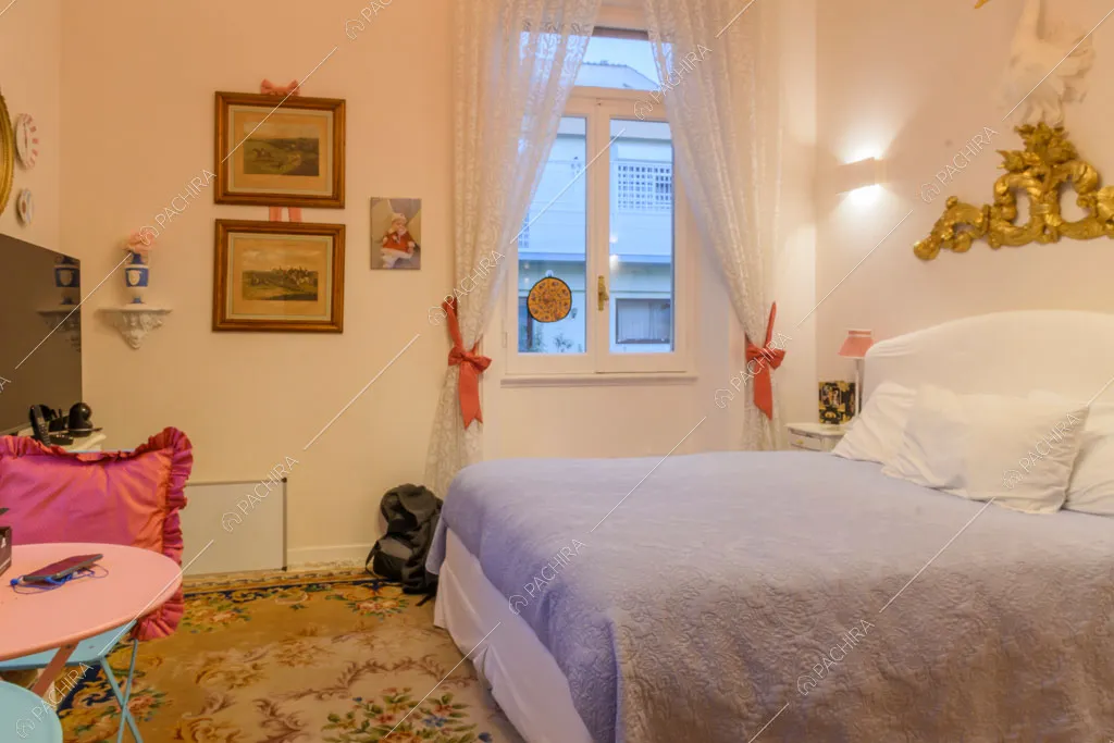 Camera da letto della location Amur, appartamento in stile insolito a Roma