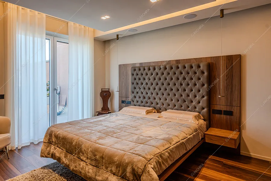 Camera da letto della location Ebano, attico in stile classico a Milano