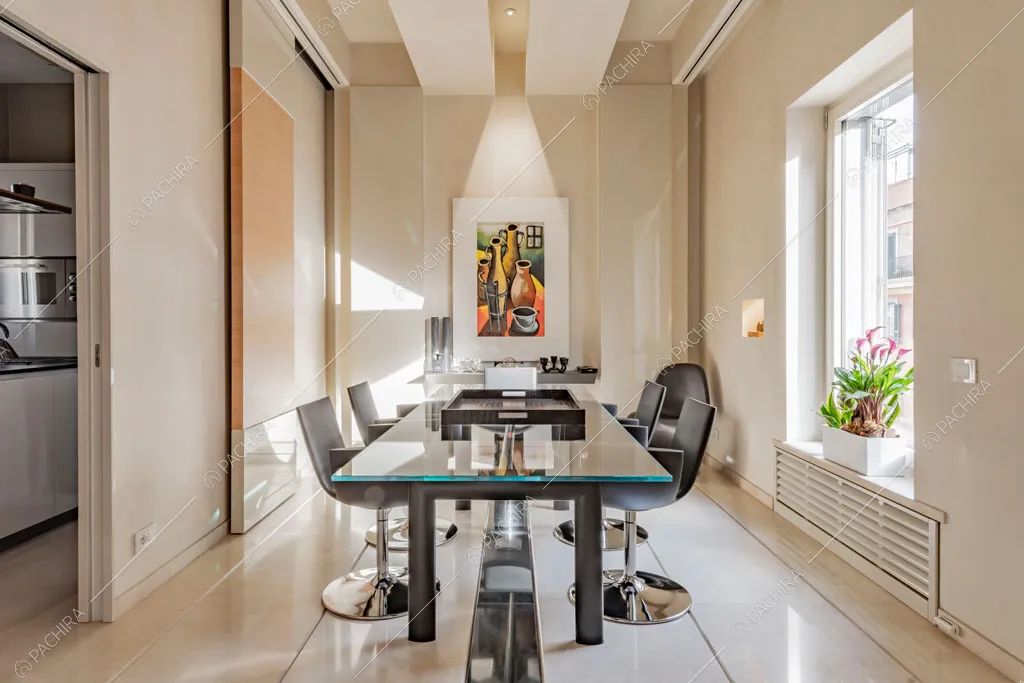 Sala da pranzo dell'appartamento Kamala, location in stile contemporaneo a Roma
