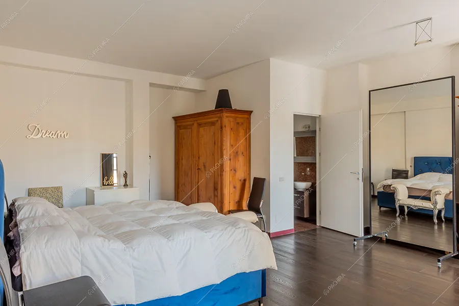 Camera da letto del loft Piave, location in stile moderno a Milano
