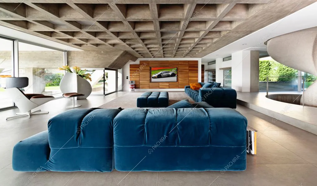 Soggiorno open space con parete in legno e soffitto a cassettoni