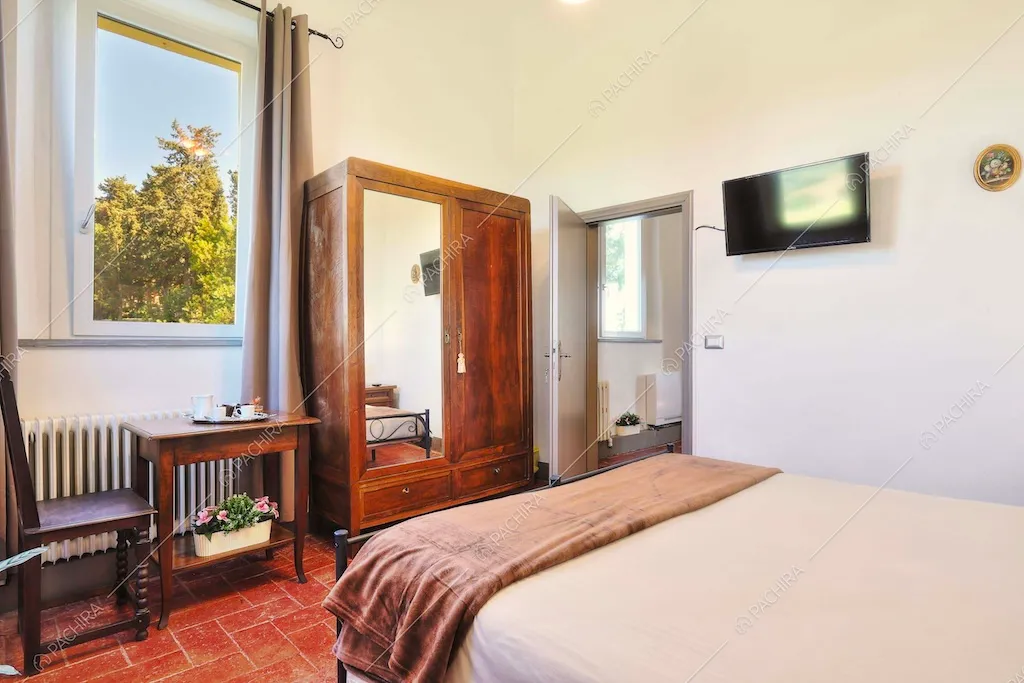 Camera da letto della dimora storica Denali, location in stile classico a Pisa