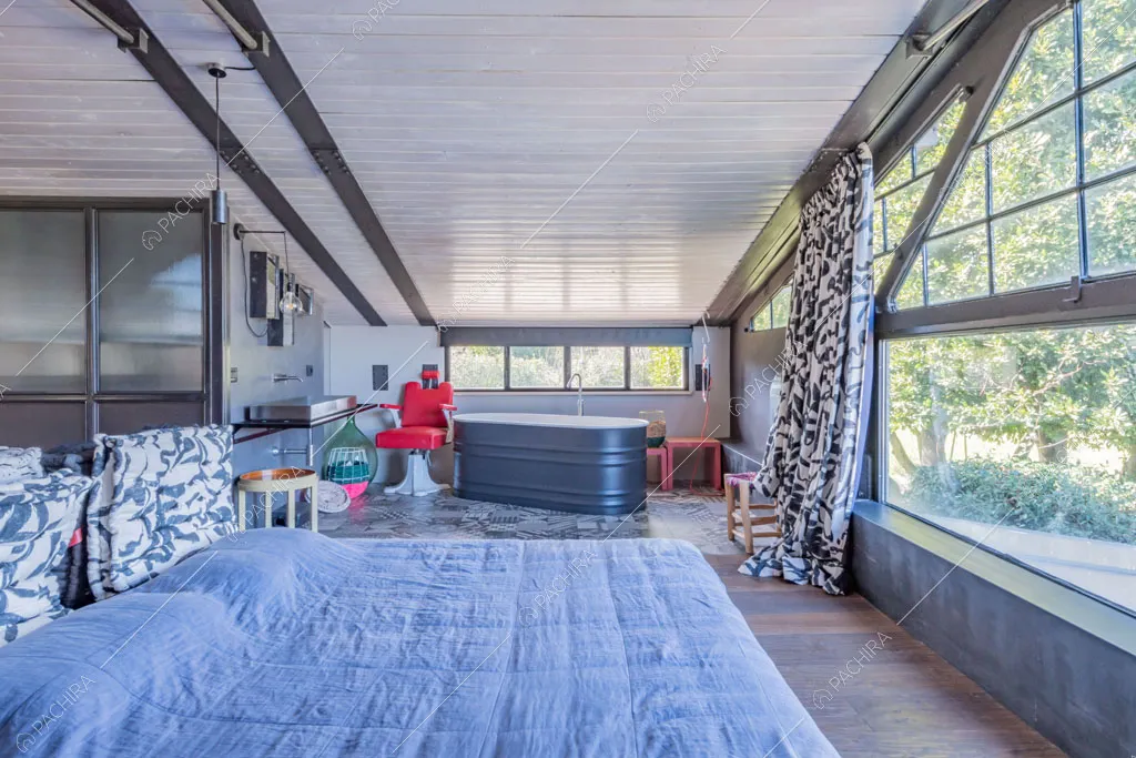 Camera da letto della location Seine, loft in stile industriale a Roma