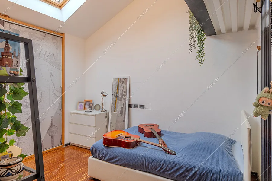 Camera da letto del loft Kiku, location in stile moderno a Milano