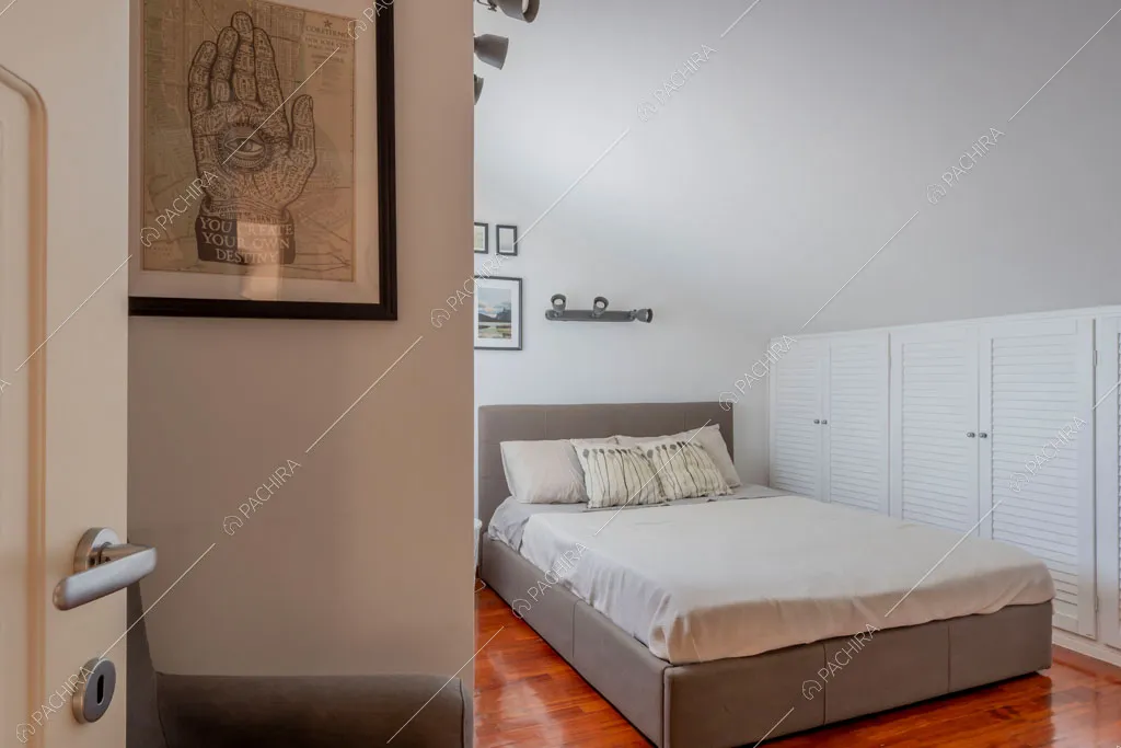 Camera da letto della villa Lena, location in stile moderno a Roma