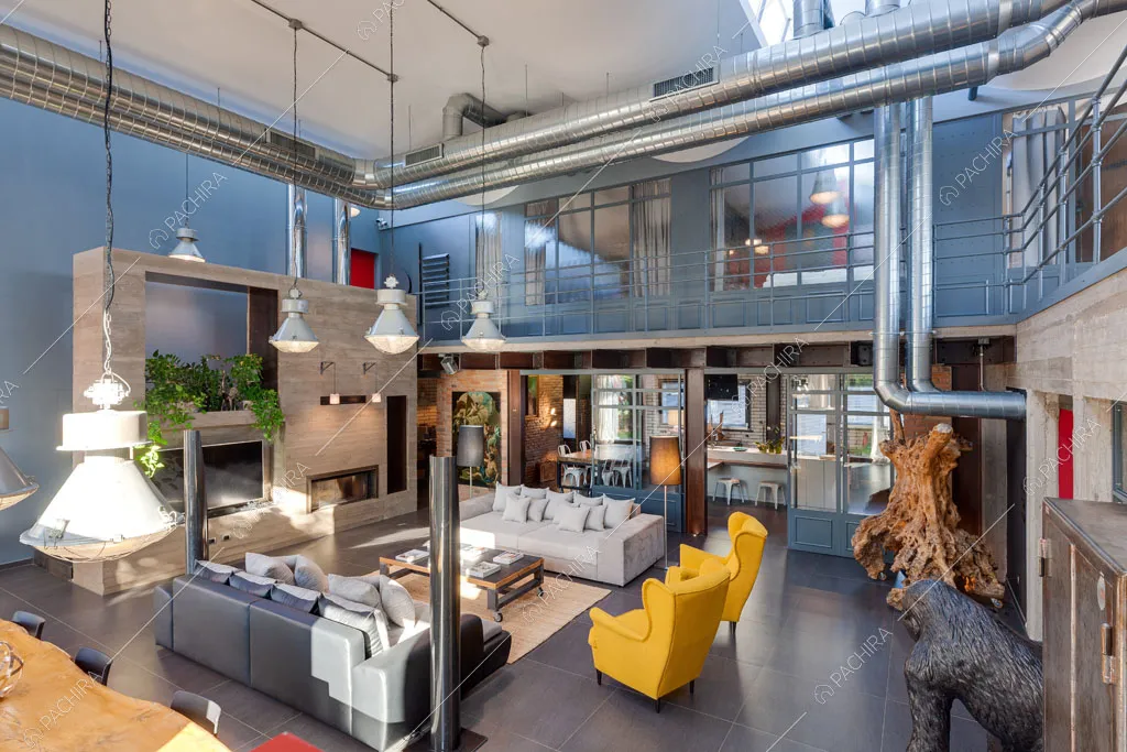 Zona living del loft Argan, location in stile industriale a Roma
