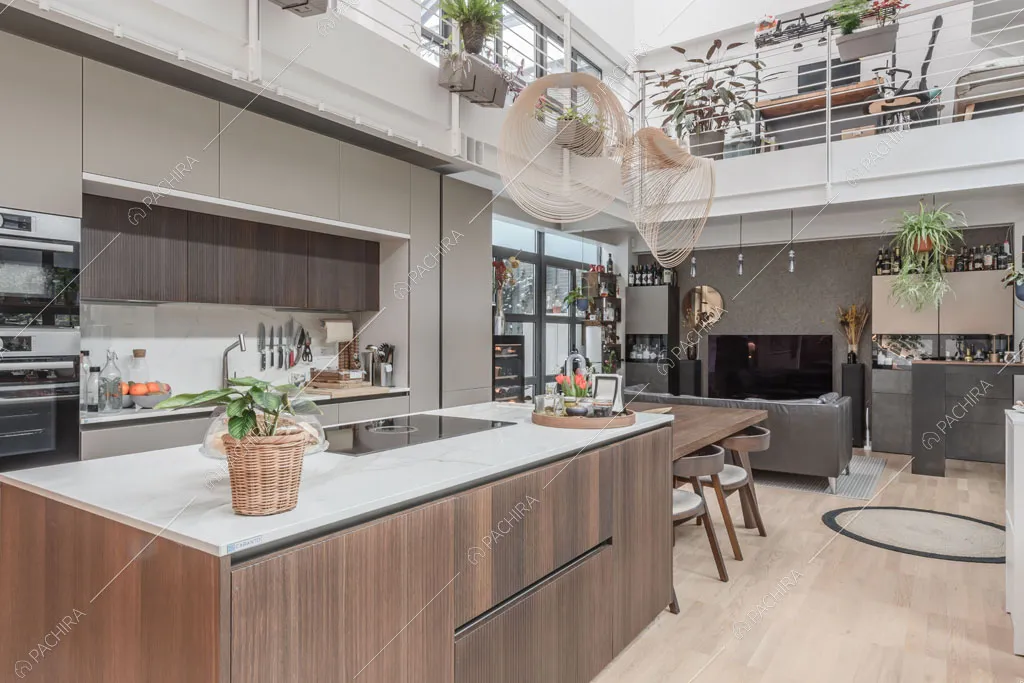 Cucina a isola con fornelli a induzione del loft Tagus, location in stile contemporaneo a Milano