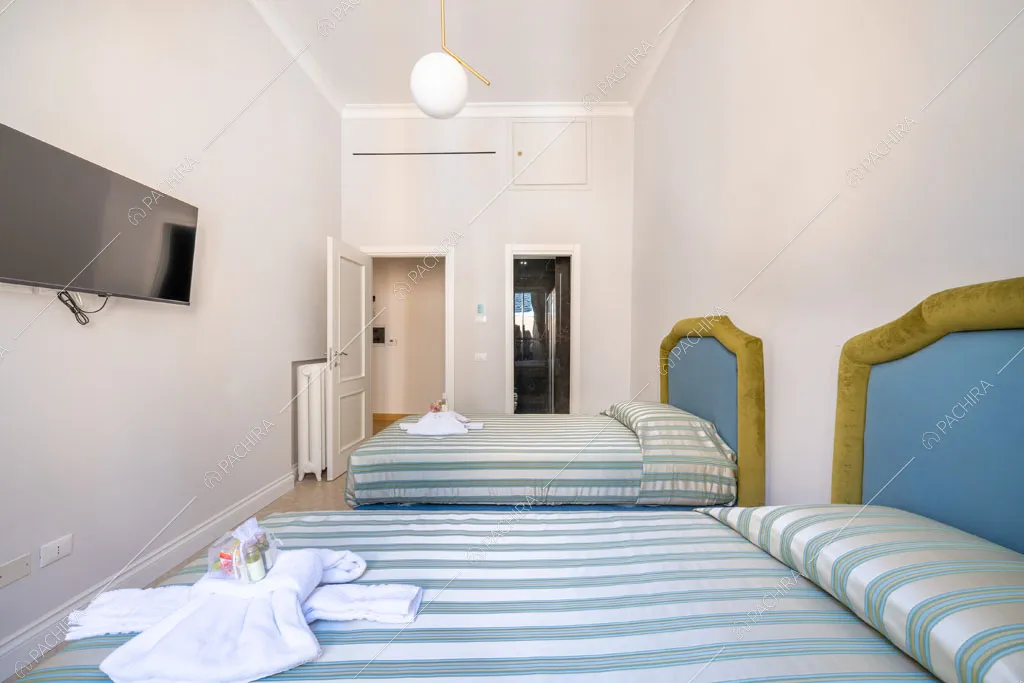 Camera da letto dell'appartamento Ural, location in stile moderno a Roma