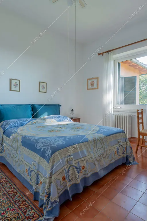 Camera da letto della dimora storica Logan, location in stile classico a Roma