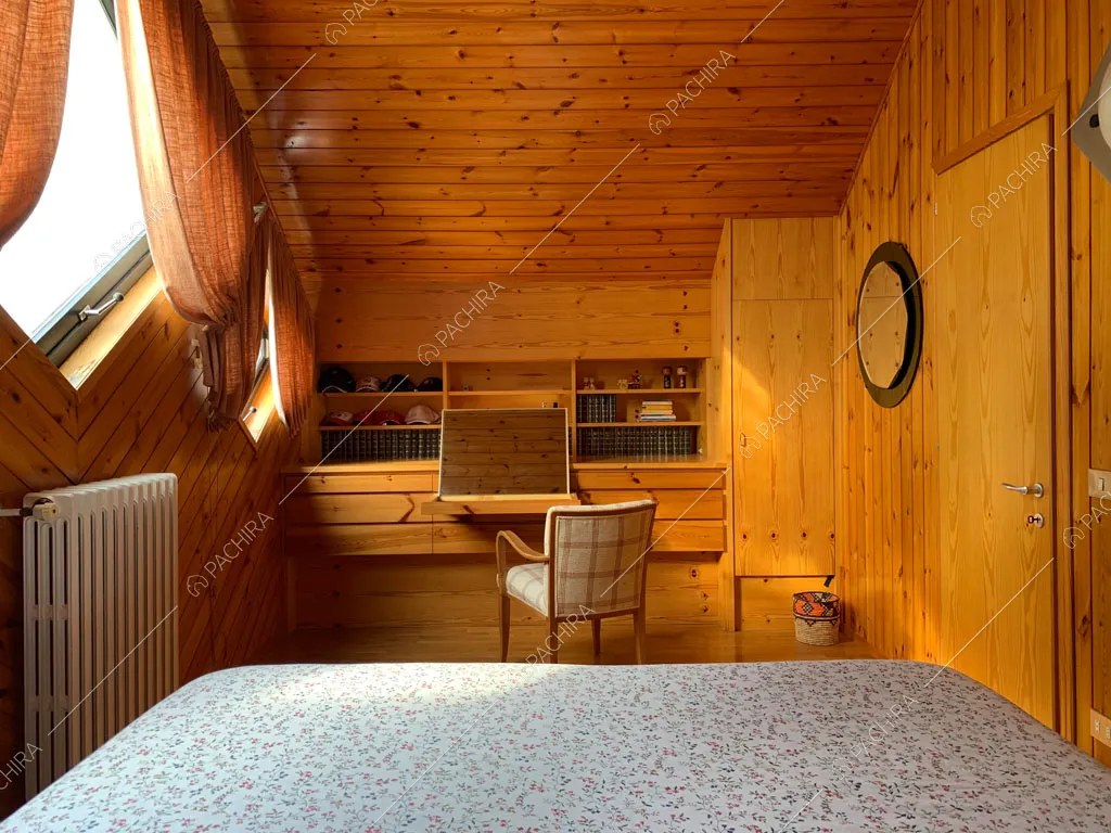 Camera da letto dello chalet Bulbine, location in stile moderno a Belluno