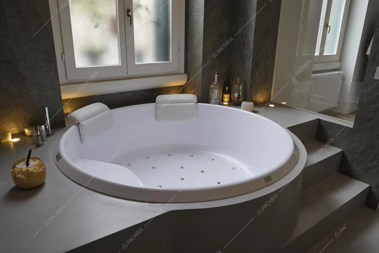 Angolo spa con grande vasca tonda e gradini