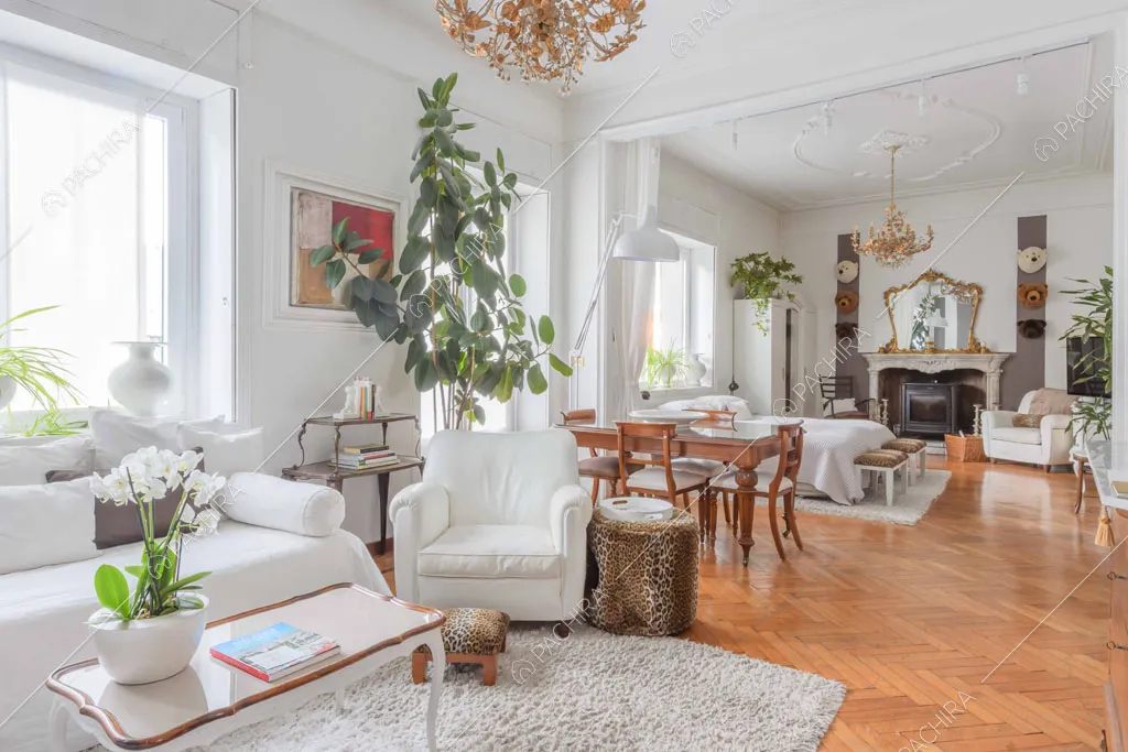 Pavimento in parquet a spina di pesce nella camera da letto matrimoniale con salotto