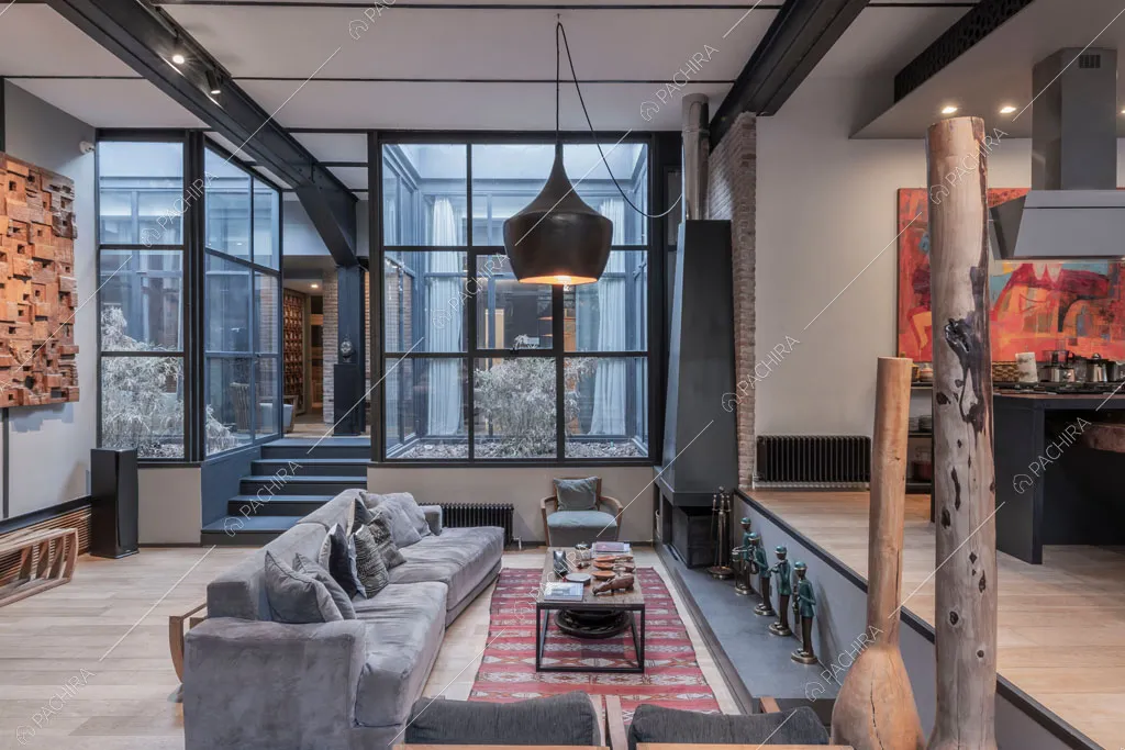 Zona living del loft Berillio, location in stile contemporaneo a Roma