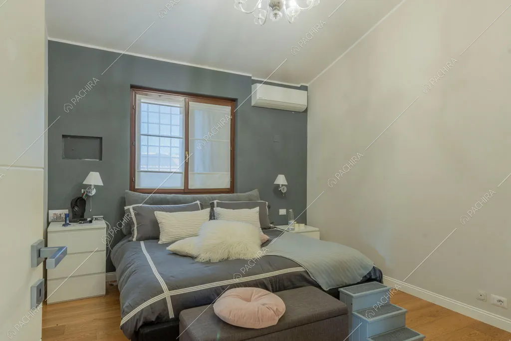 Camera da letto della villa Tagliamento, location in stile contemporaneo a Roma