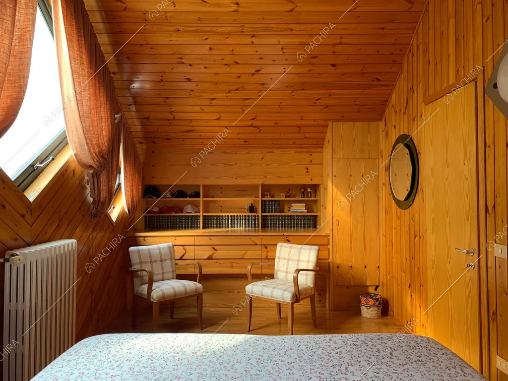 Camera da letto dello chalet Bulbine, location in stile moderno a Belluno